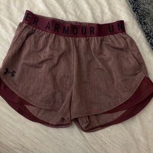 Under Armor burgundy running shorts.